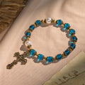Spiritual Blue Gloss Bead Bracelets Featuring Sacred Brass Crucifix