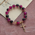 Grace and Strength Black-Pink Glass Bead Bracelet with Golden Cross