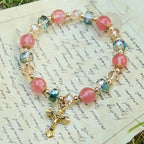 Pink Crystal & Multi-Faceted Bead Bracelet with Golden Crucifix: Dazzling Faith for Daily Style