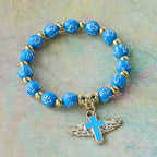 Winged Cross Charm Bracelet: A Visual Prayer of Devotion and Connection