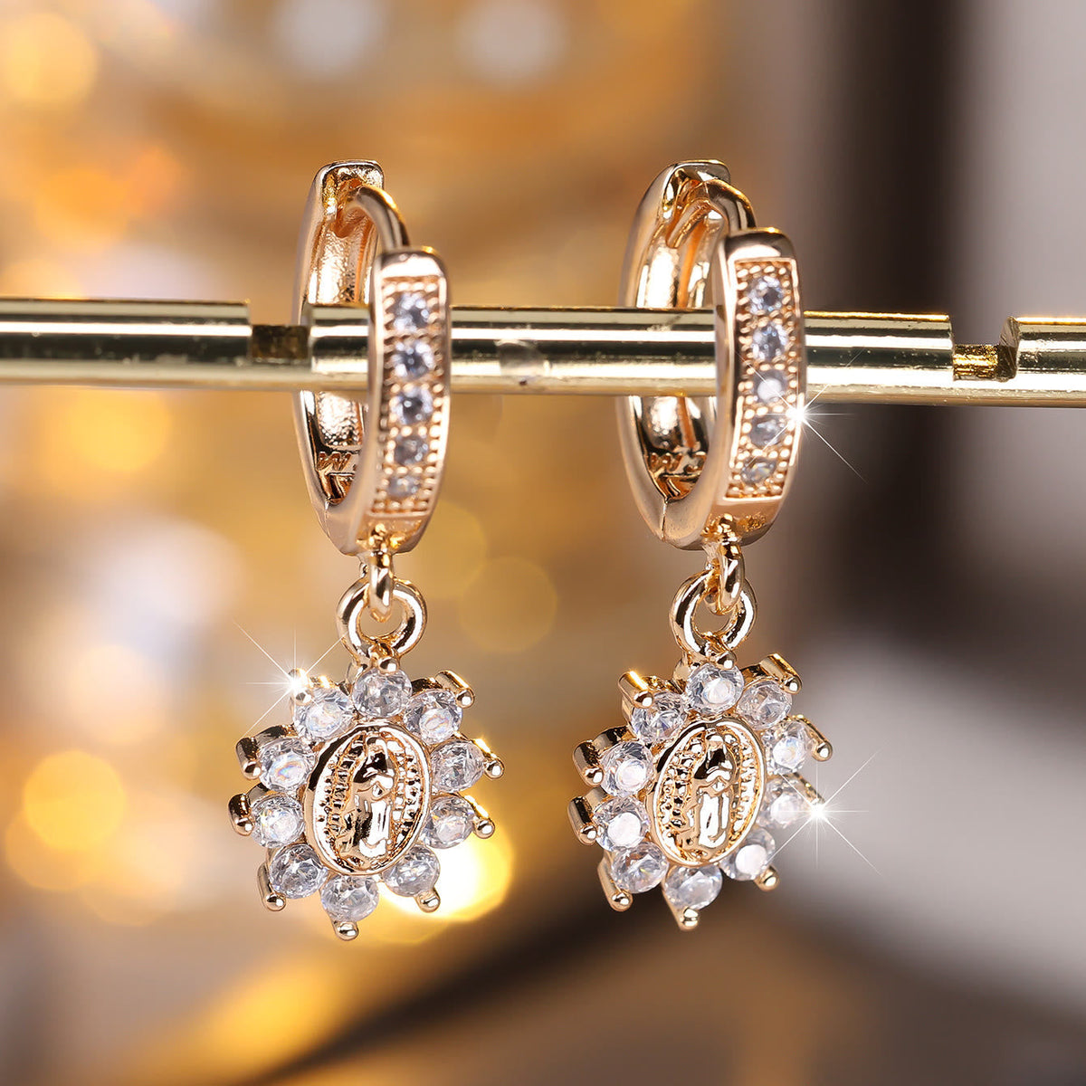 Our Lady Zircon Halo Huggie Earrings with Sunburst Medallion