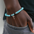 Turquoise stretch bracelet worn by a woman