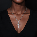 Zircon nail shaped cross pendant worn by a woman