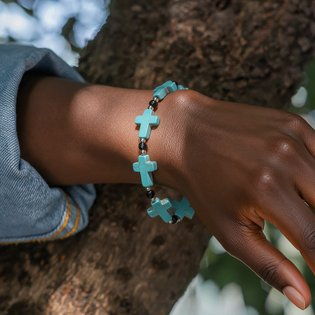 Turquoise crucifix beaded bracelet worn by a woman