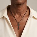 Woman wearing black cross necklace