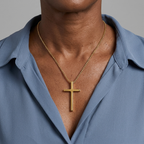 Woman wearing gold cross necklace